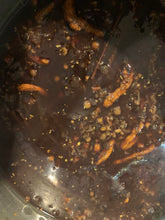 Load image into Gallery viewer, The herbs and spices will set for several hours before the straining process